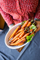 Baked roasted grilled whole carrot with spices 