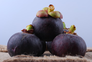 asian tropical mangosteen fruit on white background