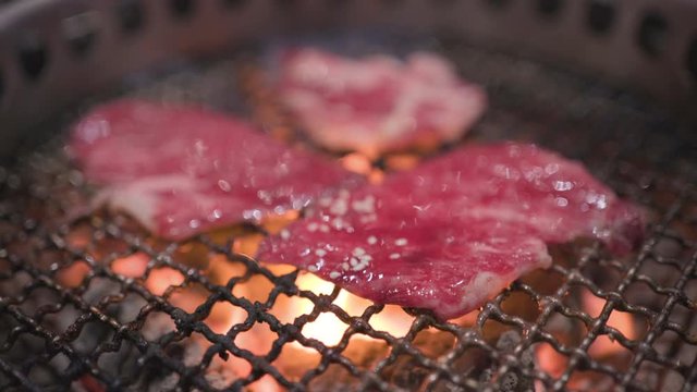 4k Japanese style grilled beef, fresh red raw meat, coal fire, japanese restaurant, huge lunch, nutrition protein fat, barbecue rack, flame grilled, dinner with family, Delicious asian food cuisine.