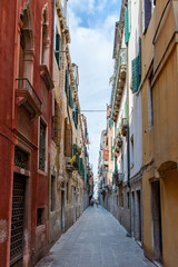 Fototapeta na wymiar Colorful Buildings in Narrow Alley in Venice Italy