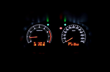 Colourful Car speedometer panel at night