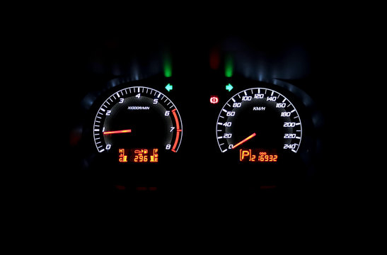 Colourful Car speedometer panel at night