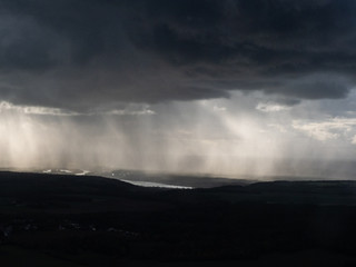 Fototapeta na wymiar vue aérienne de nuages de pluie dans le Vexin en France
