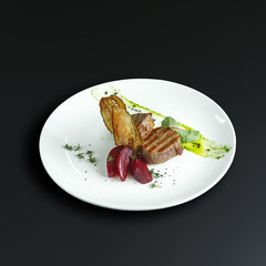 Dishes of traditional Russian cuisine. Restaurant serving. Black background.