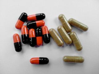 Herb capsule or Herbal capsule on white background. Medicine and pills capsules isolated on white background.
