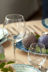 Table setting set with candles and plant branches