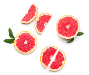 Naklejka na ściany i meble Fresh cut grapefruit on white background