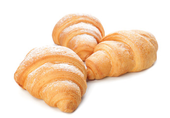 Tasty croissants on white background