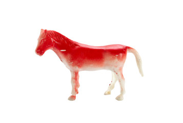 red horse plastic toy isolate on white background