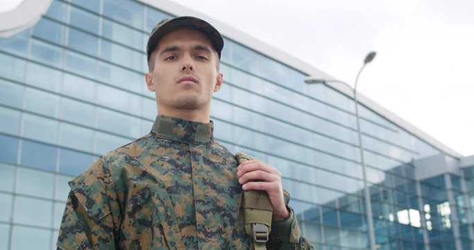 Portrait of praud young soldier.