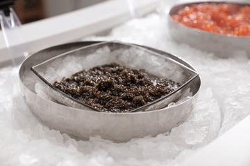 Delicious black caviar on ice. Wholesale market