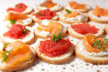 buffet food, dining appetizer snack, canape with salmon and caviar