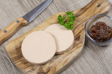 slices of foie gras on a cutting board