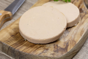 slices of foie gras on a cutting board