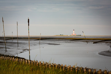 North sea at low tide with lighthouse in the background