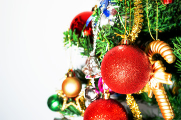 red ball and Ornaments on christmas tree on white background