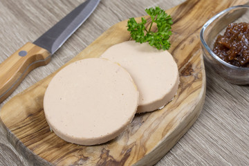 slices of foie gras on a cutting board