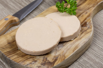 slices of foie gras on a cutting board