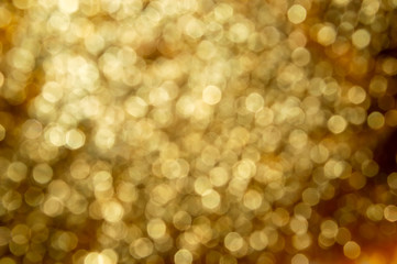 gold bokeh on black background