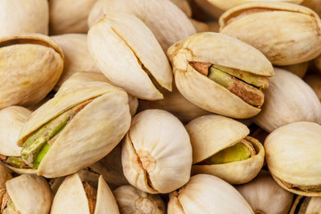 Background of delicious pistachios isolated on white background