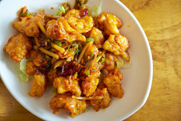 Fried chicken and vegetable with spicy sauce 