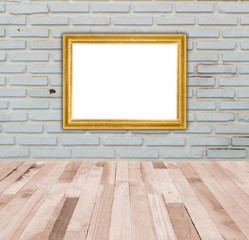 gold frame on white brick wall and brown plank wood floor