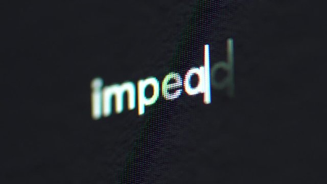 Macro typing on screen text words impeach on black background pixels shallow depth of field