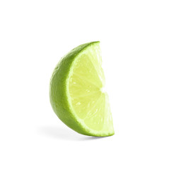 Slice of fresh ripe lime isolated on white
