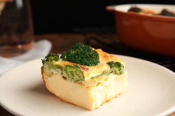 Tasty broccoli casserole on ceramic plate, closeup