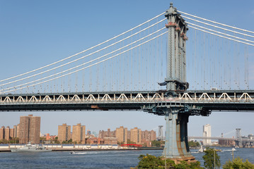 The Manhattan Bridge tower closest to Brooklyn over the Hudson river. Taken in New York City on September the 28th, 2019