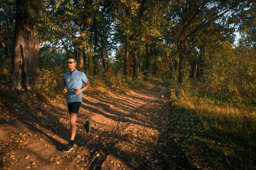 Fototapeta premium Man jogging in park. Running.