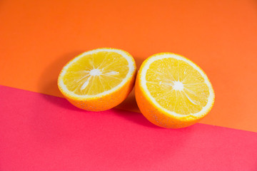 half cut orange on orange and red background for orange products designs and websites