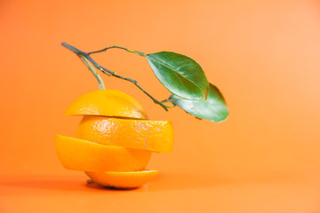 orange cut into slices abstract inspirational orange with fresh leafs for orange products design...
