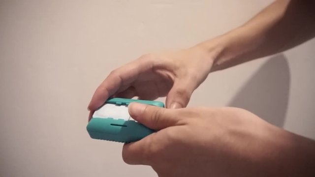 Anti-mosquito fumigator tablet change in hands