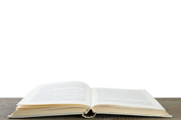 Open old hardcover book on wooden table