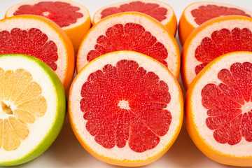 Pomelo and grapefruit slices background.