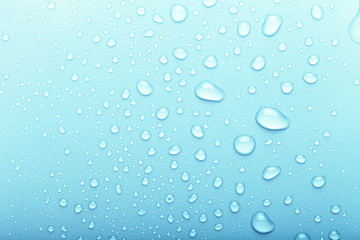 Drops of water on a color background. Selective focus. Blue. Toned