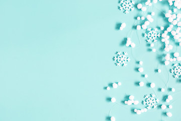 Christmas or winter composition. Pattern made of snowflakes and snowballs on pastel blue background. Christmas, winter, new year concept. Flat lay, top view, copy space