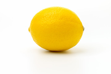 a big yellow lemon on a white background isolated, front view