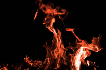 Bonfire on a black background. Fire pattern. Tongues of flame on black isolated background