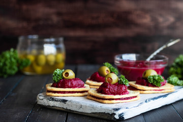 Beetroot relish on crackers. An original party snack.