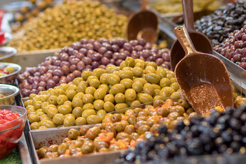 Olives. Of all varieties and in all shapes! Blacks, greens, bigs, little ones, Syrians, Arabs, bloody, conquered, and skulls. Kosher Food, Mahane Yehuda Market, Jerusalem, Israel.
