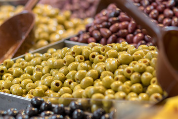 Olives. Of all varieties and in all shapes! Blacks, greens, bigs, little ones, Syrians, Arabs, bloody, conquered, and skulls. Kosher Food, Mahane Yehuda Market, Jerusalem, Israel.