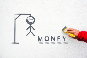 word money,  hangman traditional game on wall and hand with paint brush