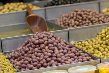 Olives. Of all varieties and in all shapes! Blacks, greens, bigs, little ones, Syrians, Arabs, bloody, conquered, and skulls. Kosher Food, Mahane Yehuda Market, Jerusalem, Israel.
