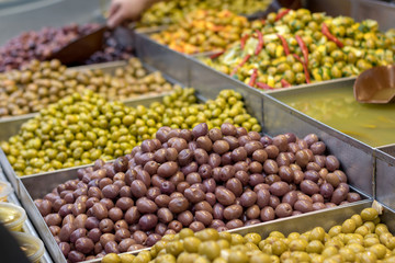 Olives. Of all varieties and in all shapes! Blacks, greens, bigs, little ones, Syrians, Arabs, bloody, conquered, and skulls. Kosher Food, Mahane Yehuda Market, Jerusalem, Israel.