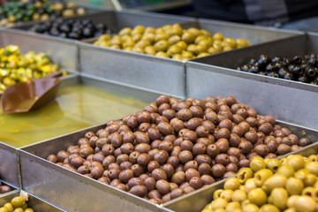 Olives. Of all varieties and in all shapes! Blacks, greens, bigs, little ones, Syrians, Arabs, bloody, conquered, and skulls. Kosher Food, Mahane Yehuda Market, Jerusalem, Israel.