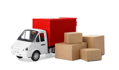 Toy truck with boxes isolated on white. Logistics and wholesale concept