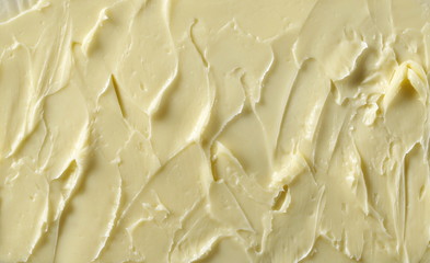 Yellow butter surface background and texture
