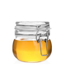 Jar of organic honey isolated on white